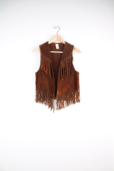 Vintage 70's brown suede waistcoat with fringe along the front, sides and bottom. The waistcoat also features western silver concho detail at the back. The waistcoat has no fastenings and is intended to be worn open.  good condition - some light marks to the suede and the fringe is creased at the back (see photos)  Size in Label:&nbsp;  Womens S