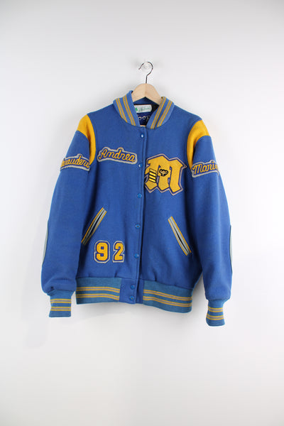 Vintage College Varsity Jacket in a blue and yellow colourway, woollen with a nylon lining, button up, and has embroidered logos throughout.