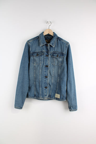 Vintage Harley Davidson Denim Jacket in a blue colourway, button up, double chest pockets, and logo embroidered on the front and back.