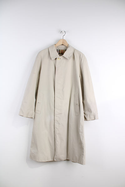 Vintage Burberry Mac Coat in a tan colourway, button up, side pockets and has the signature nova check lining.