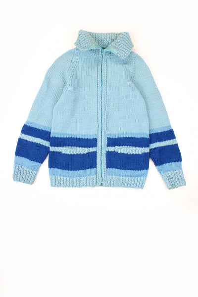 Vintage chunky knit cardigan in light blue with darker blue stripe design. No label - amusing its hand made. Has two front pockets and closes with a zip.  good condition  Size in Label:  No Size - Measures like a size S