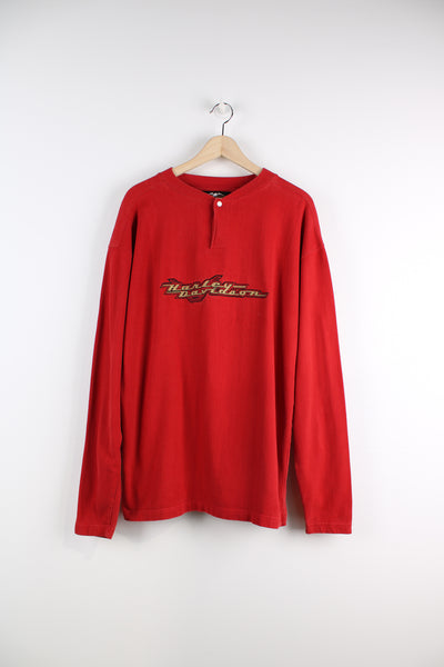 Harley Davidson Long Sleeve T-Shirt in a red colourway, quarter button up, and has the logo embroidered across the chest.