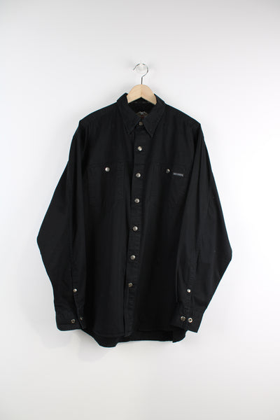 Harley Davidson Long Sleeved Shirt in a black colourway, button up, double chest pockets and logo embroidered on the front and big spell out on the back.