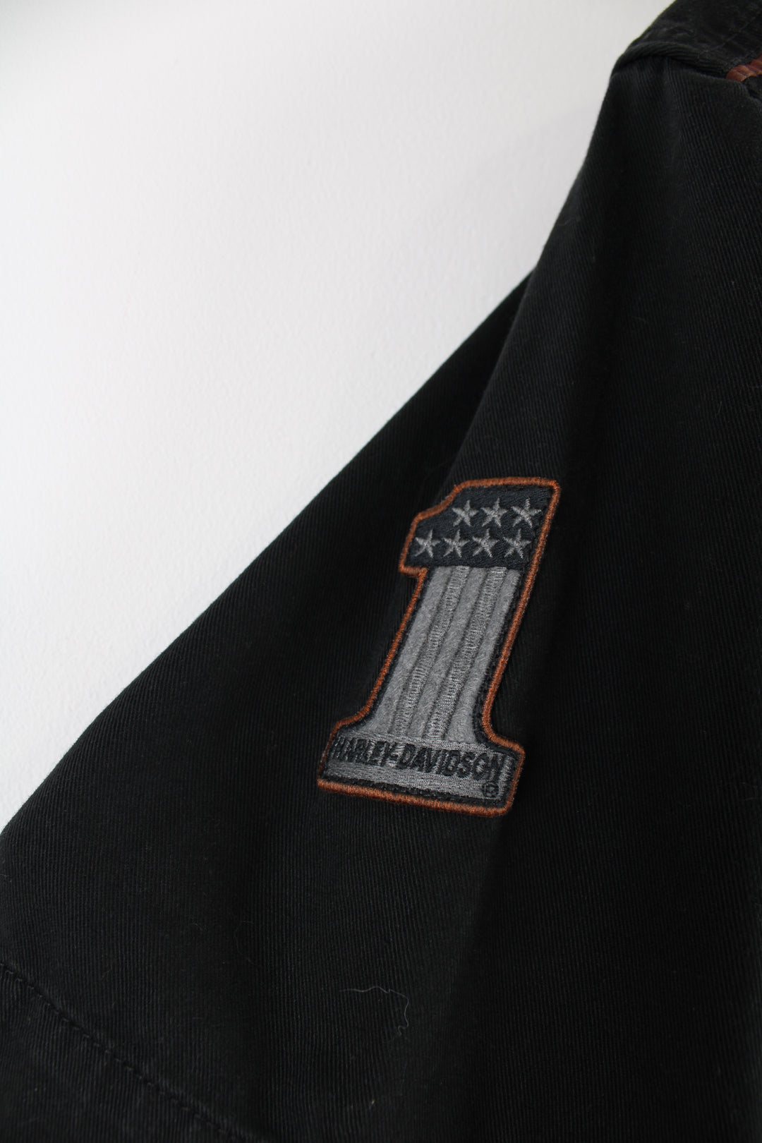 Harley Davidson Short Sleeved Shirt in a black and grey colourway, button up with a chest pocket, and logos embroidered throughout as well as big spell out on the back.