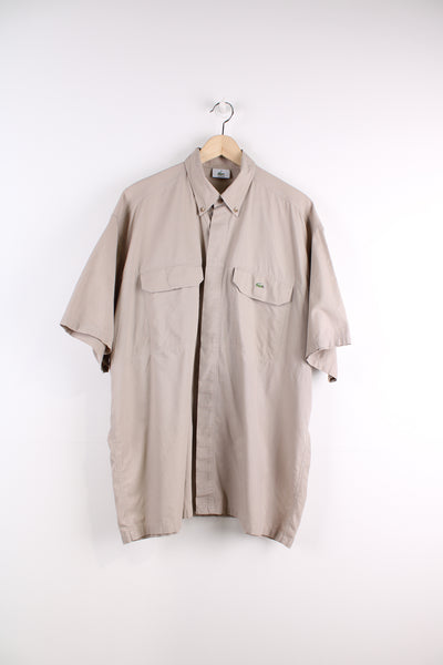 Lacoste Short Sleeve Shirt in a tan colourway, button up, double chest pockets, and logo embroidered on the side.