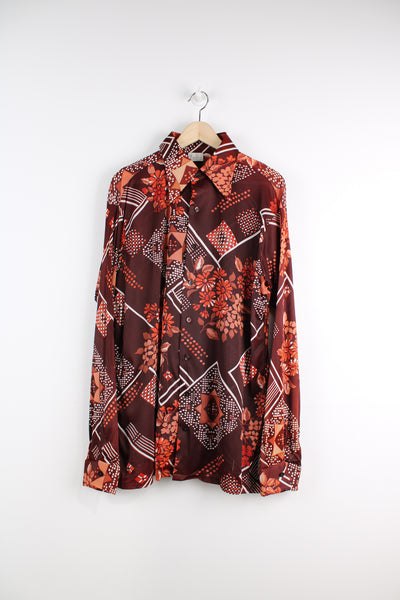 Vintage 70's Sears Patterned Shirt in a maroon colourway with floral pattern printed all over, button up, and has a dagger collar.
