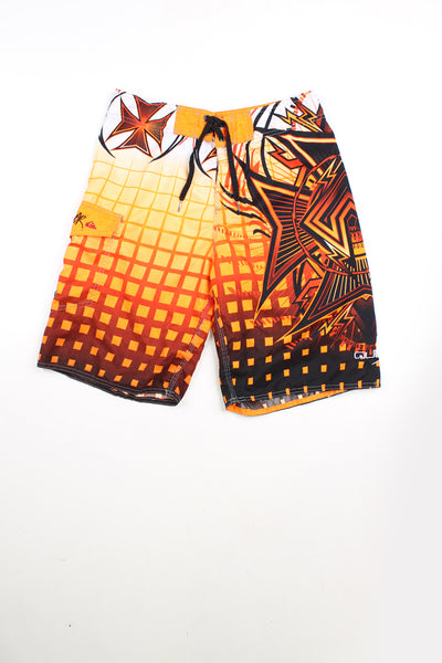 Orange and black Quicksilver swim shorts. Features tie waist, embroidered logo, and pocket on the leg.