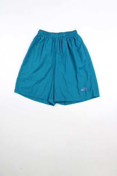 Vintage Nike turquoise shorts with elasticated drawstring waist. Features embroidered logo.
