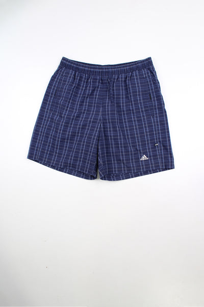 Blue Adidas checked shorts with elasticated waist and drawstring. Features embroidered logo on the leg.