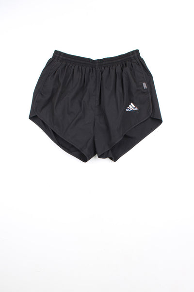 00's black Adidas running shorts with elasticated waist and drawstring tie. Features embroidered logo on the front leg.