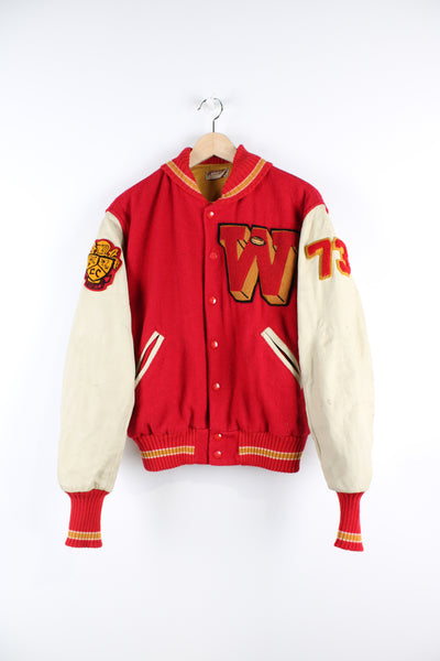 Vintage 70's college varsity jacket, button up with embroidered patches throughout the jacket. 