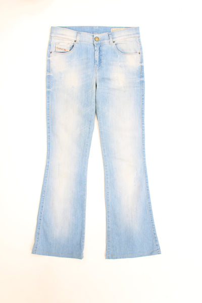 Vintage Y2K light wash Diesel stretchy slim leg, bootcut jeans with embroidered logo on the pocket