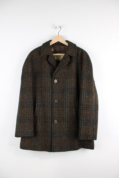 Vintage Aquascutum wool overcoat, button up, has a quilted lining, and side pockets.