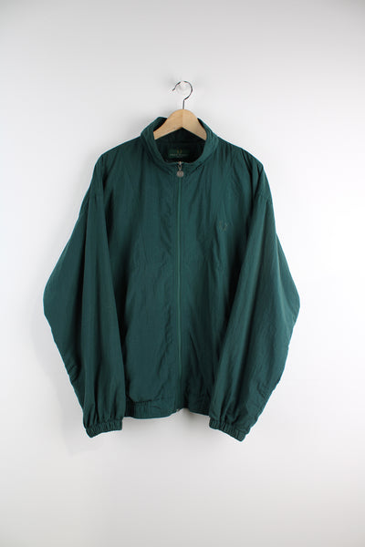 Vintage forest green Fred Perry zip through shell jacket features embroidered logo on the chest and zip up pockets