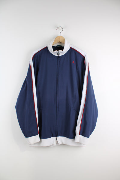 Nike X Air Jordan navy blue and white tracksuit top, features Michael Jordan  printed motif on the back and red piping details 