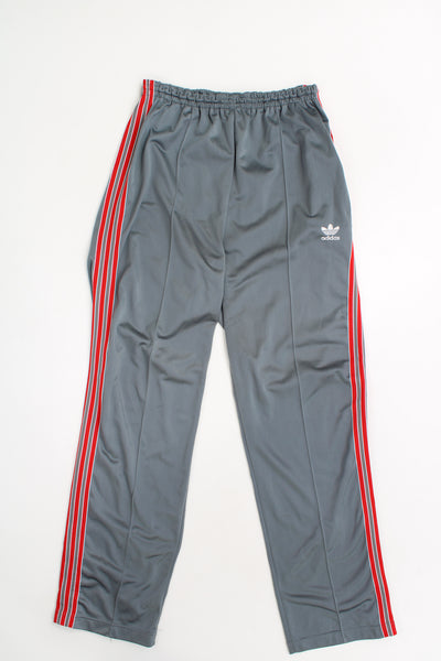 Vintage 80's Adidas grey and red tracksuit bottoms with elasticated waistband, signature three stripes 