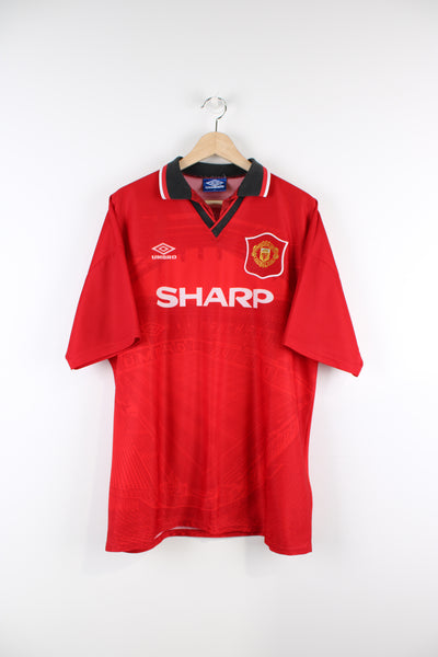Manchester United Umbro 1994/96 home football shirt, red team colourway, Old Trafford design and has embroidered logos on the front.