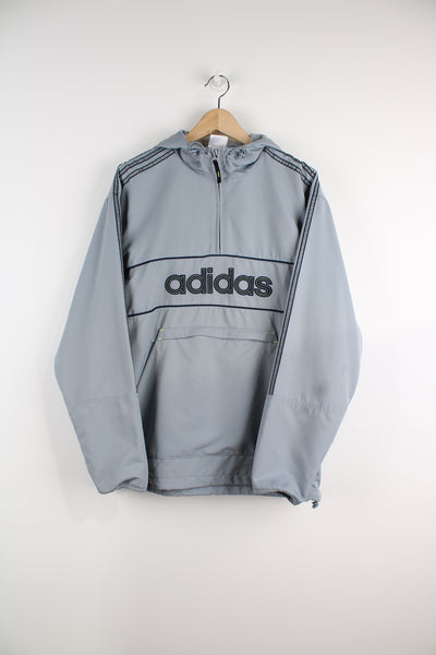 Vintage Adidas lightweight pullover in all grey, features embroidered spell-out logo across the chest with large zip up pocket in the front&nbsp;