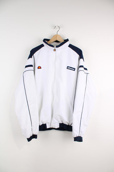 Ellesse zip through white tracksuit top with embroidered logo on the chest and zip up pockets