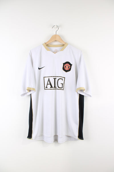 Manchester United 2006/08 Nike away football shirt, whit colourway with embroidered logos on the front.