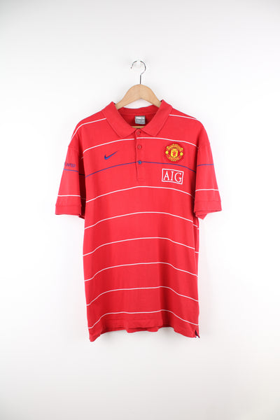 Vintage Manchester United, Nike Polo Shirt in a red, white and blue striped colourway, button up and has logos embroidered throughout the shirt.