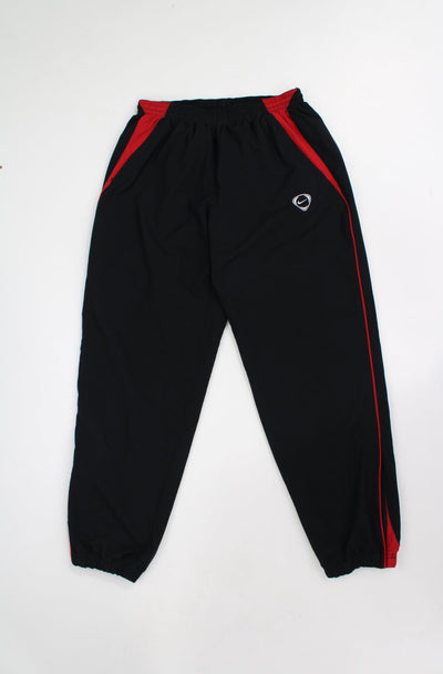 00's Nike black tracksuit bottoms with embroidered logo on the hip, elasticated waist and cuffs  