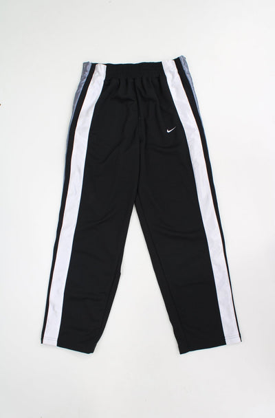 Nike black and silver basketball tracksuit bottoms with elasticated waist poppers down both legs 