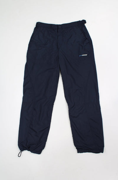 Reebok navy blue tracksuit bottoms with embroidered logo on the pocket, adjustable velcro waist band and drawstring cuffs