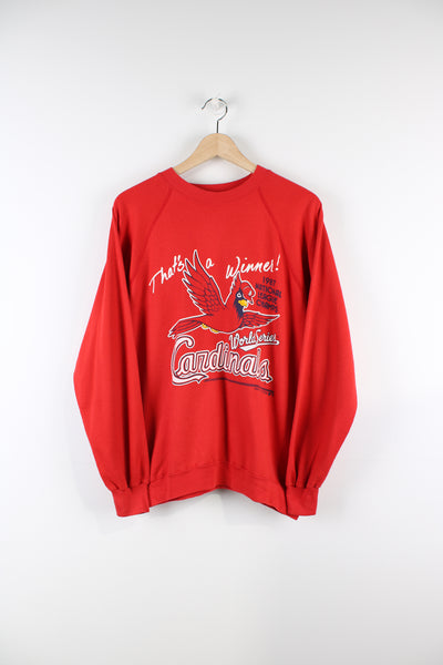Vintage Louisville Cardinals MLB 1987 national league champions sweatshirt in red, graphic design and spell-out on the front.