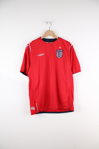 Vintage England 2004/06, Umbro Away Football kit in a red and white colourway, and has embroidered logos on the front.