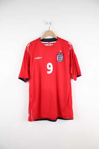 Vintage England 2004/06, Umbro Away Football kit in a red and white colourway, Wayne Rooney number 9 printed on the back and also has logos embroidered on the front.