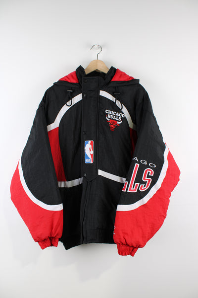 Vintage Chicago Bulls NBA jacket, red, black and white team colourway, zip up jacket, hooded, quilted lining and has logos embroidered throughout the jacket. 