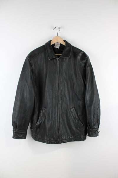 Vintage Adidas Boston Athletic Association leather jacket in black, zip up with two side pockets, has a quilted lining and embroidered logos on the sleeve and back of the jacket.