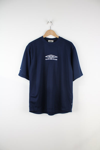Vintage 90's Umbro Training T-Shirt in a blue colourway, 100% polyester, and has the logo embroidered on the front and sleeve.