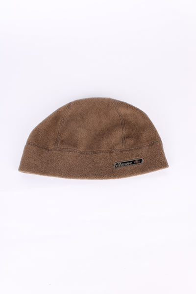 Vintage Ellesse beanie in brown, fleece material with embroidered logo on the front. 