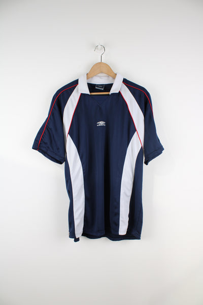 Vintage 90's Umbro Training T-Shirt in a blue and white colourway, 100% polyester, and has the logo embroidered on the front.