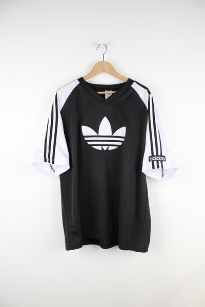 Adidas Training T-Shirt in a black and white colourway, V-neck, 3 stripes going down the sleeves, and big embroidered logo on the front.