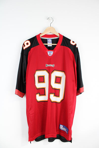 Red and black Tampa Bay Buccaneers NFL Jersey, by Reebok. With printed name Warren Sapp #99 on the back 