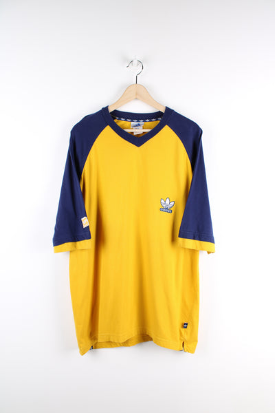 Late 90's yellow and blue Adidas t-shirt, features embroidered logo on the chest