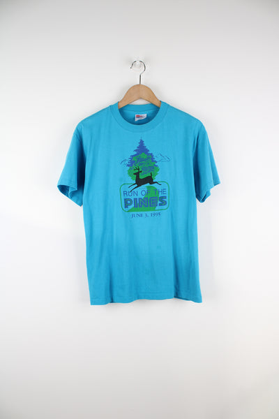 Vintage 1995 'Run of the Pines' blue single stitch t-shirt by Hanes features printed graphic on the front  