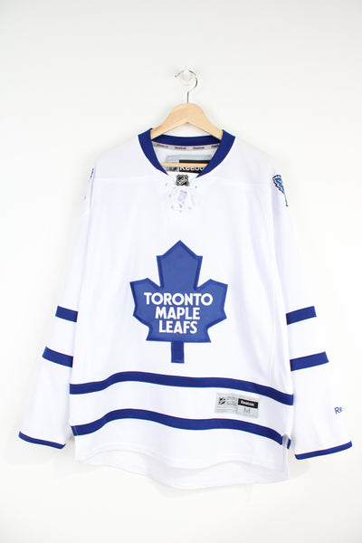 Toronto Maple Leafs white and blue NHL jersey, by Reebok with embroidered lettering and badges