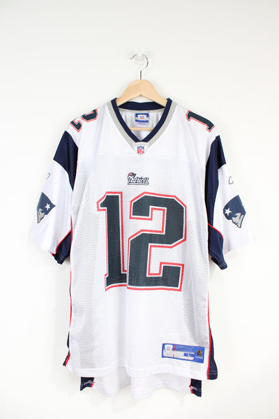 Tom Brady #12 New England Patriots NFL jersey, by Reebok. With printed logo and number front and back