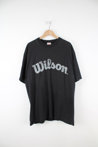 Faded black oversized 100% cotton t-shirt by Wilson, features spell-out graphic across the chest