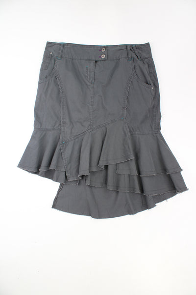 Y2K green/ grey cargo style skirt with distressed ruffle asymmetrical hem. Could be worn mid or low rise depending on measurements. Made by Next.  good condition  Size in Label: Womens 16 (XXL) 
