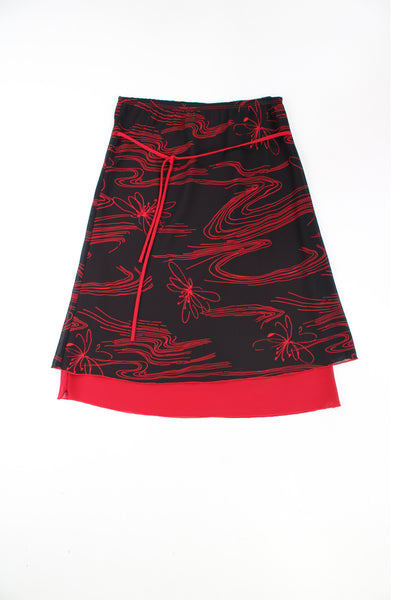Y2K stretchy midi skirt in black and red pattern with red tie at the front. good condition Size in Label: Womens M - can stretch to fit multiple sizes