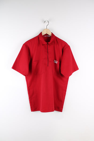 Ben Davies short sleeve workwear shirt in red, half zip, double chest pockets, and embroidered logo on the front. 