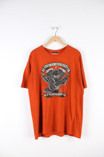 Vintage Harley Davidson motorcycles Anthem, Arizona T-shirt in orange, has logo and eagle design printed on the front, and Arizona snake themed graphic on the back. 