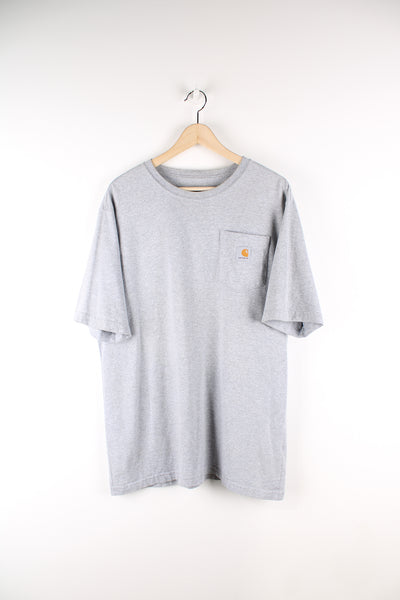 Vintage Carhartt T-shirt in grey, with a chest pocket and embroidered logo on the front. 