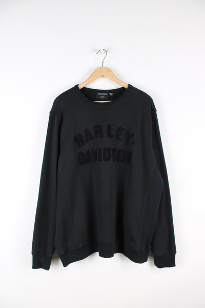 Vintage Harley Davidson sweatshirt in black, crew neck with embroidered Harley Davidson spell out across the front.