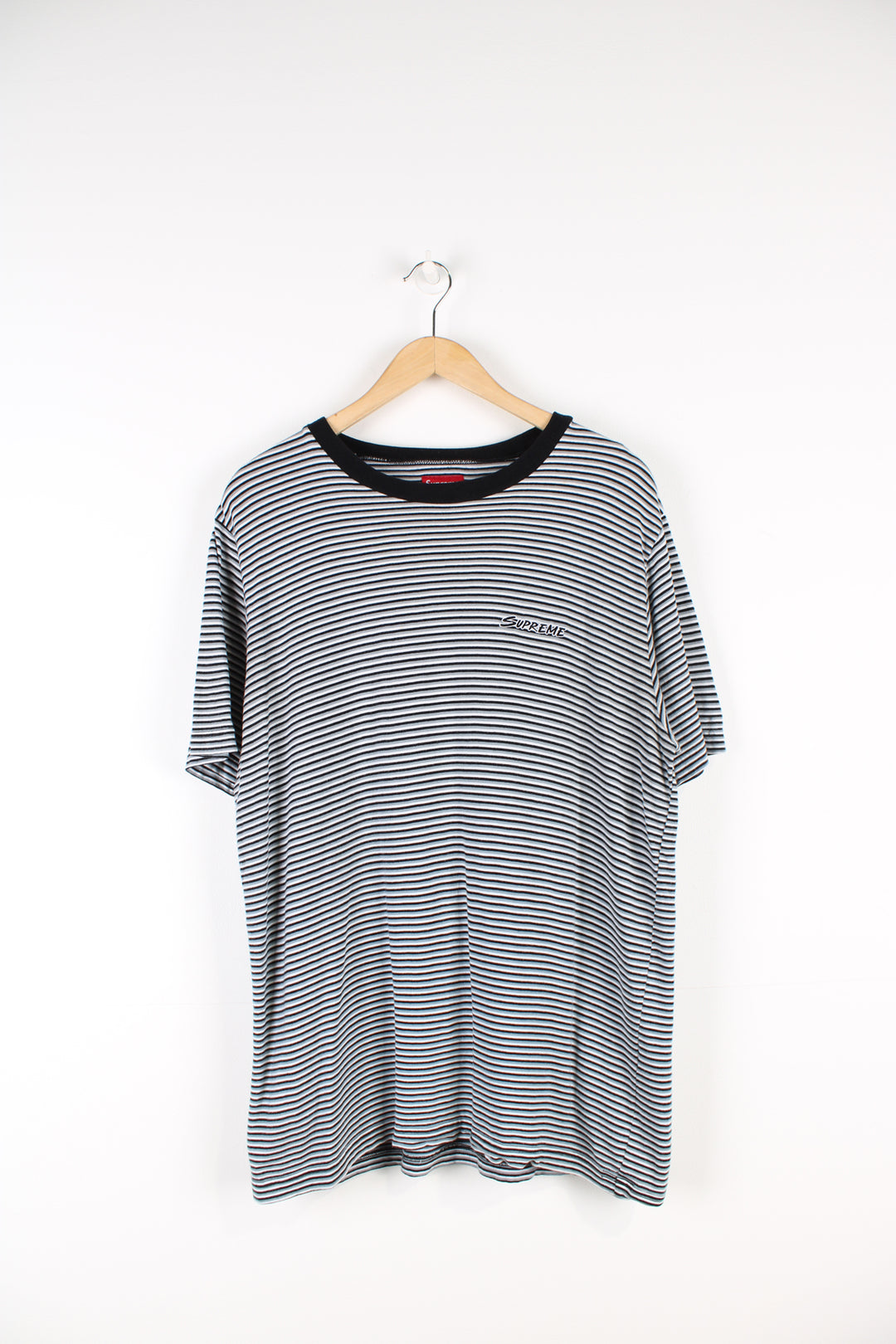 Supreme black, white and grey striped t-shirt, features embroidered spell-out on the chest